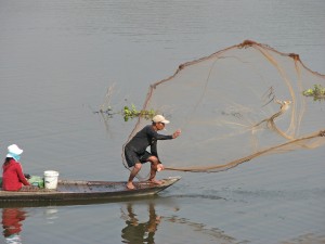 Net fishing is common on this stretch of the Mekong between Phnom Penh and the Vietnam border.